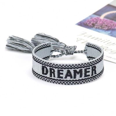 China TRENDY handmade friendship woven bracelet with words logo cotton woven bracelet with embroidery texts for sale