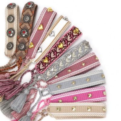 China FASHIONABLE high quality woven bracelet with embroidery texts and friendship bracelet with rivets handmade bracelet for with studs for sale