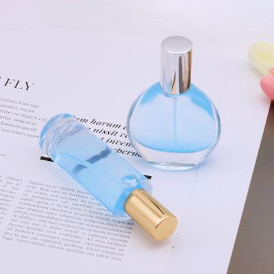 China Cheap 30ml Eco-friendly Custom Luxury 50ml Flat Round Clear Empty Perfume Glass Bottle Packaging for sale