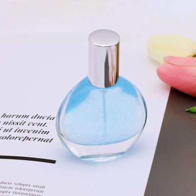 China Luxury Eco - Friendly Perfume Bottles Glass Flat Round Perfume Bottle 30Ml for sale