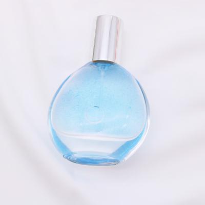 China Eco-Friendly Luxury Empty Round Perfume Spray Pump Perfume Glass Bottle Gold Empty Perfume Bottle for sale