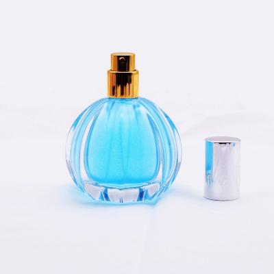 China Free Sample Luxury Round 50ml Empty Pumpkin Eco - Friendly Shaped Glass Perfume Spray Bottle With Aluminum Cap for sale