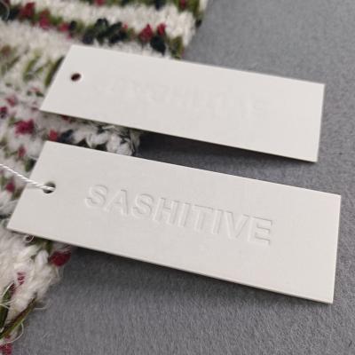 China Custom Recyled Logo Clothing Debossed Paper Hang Tag With String Luxury Clothing Tag Thickness For Garment for sale