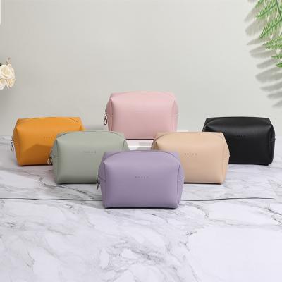 China 2019 Fashion Letter Embossing PU Cosmetic Wash Bag Women Bags Woman for sale