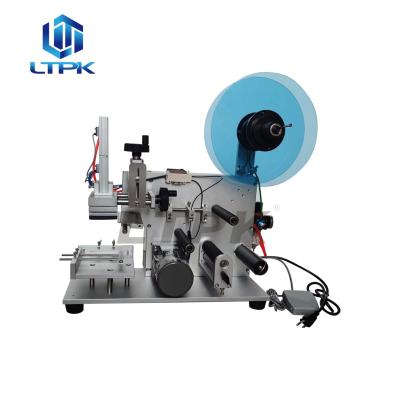 China LT-60 Pneumatic Food Flat Surface Bottle Labeling Machine Tabletop Labeler for sale