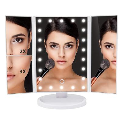 China Lit 2021 Product Factory Price Tender Folding 3 Sides Magnifying Shine Adjustment Touch Sreen Makeup Mirror With Light Vanity for sale