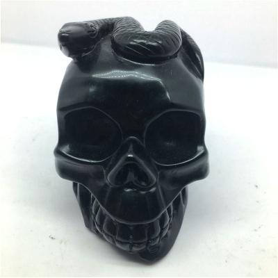 China China hot sale natural black obsidian crystal skulls with snake for home decoration for sale