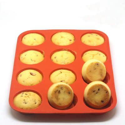 China Non Viable Stick Round 12 Cup Silicone Muffin Cups Cake Mold Silicone Cupcake Baking Mold for sale