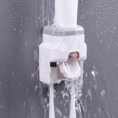 China New Modern Automatic Toothpaste Dispenser Toothbrush Holder Bathroom Bathroom Products for sale