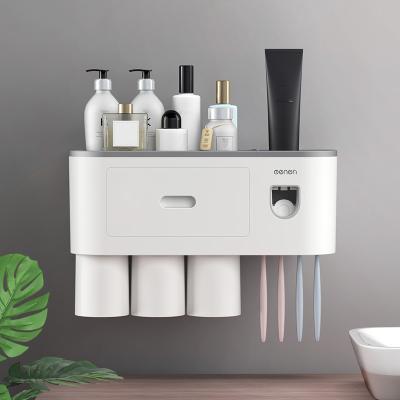 China Modern Magnetic Bathroom Accessories Holder Automatic Toothpaste Squeezer Dispenser Toiletries Storage Rack for sale