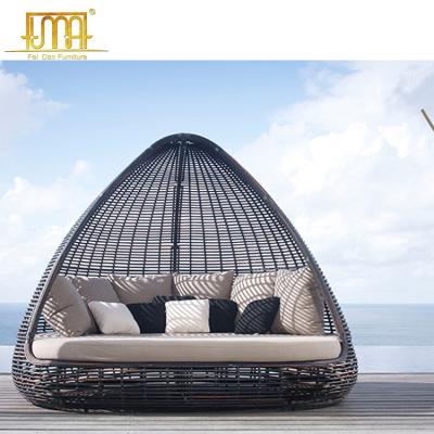 China Modern thick patio beach rattan material pyamidal cocoon shaped chair outdoor wicker daybed for sale