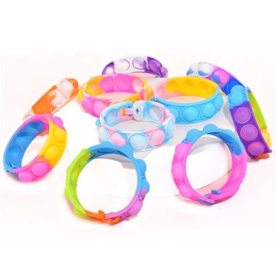 China Silica Gel Push It Bubble Jumping Person Jumping Bracelet Sensory Toy Bracelet For Kids for sale