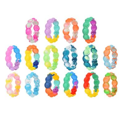 China Silica Gel Braceleys Finger Push Rainbow Bracelet Bubble Jumpy Person Toy Jumping Bracelet Push It For Kid for sale