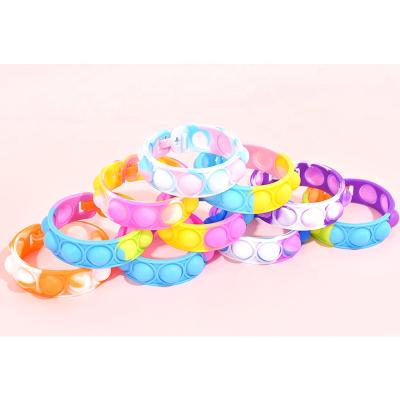 China New Design Silica Gel Rainbow Push It Bubble Bounce Jumping Person Toy Bracelet For Kid for sale