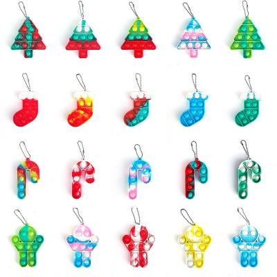 China Silicone plastic christmas ginger man push navidad jumping key chain socks wiggle it to toys candy key chain accessories for sale