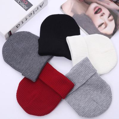 China COMMON Wholesale Price Unisex Winter Knitted Acrylic Elastic Winter Beanie Solid Color Keep Warm Hats For Man And Women for sale