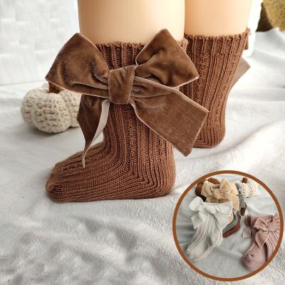 China Viable Hot Sale Children Autumn Winter Socks Baby Big Color Bow Mid-calf Length Sheer Socks Soft Cotton Socks for sale