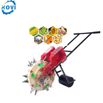 China Hand Held Seed Planter Corn Planter With Fertilizer Box for sale