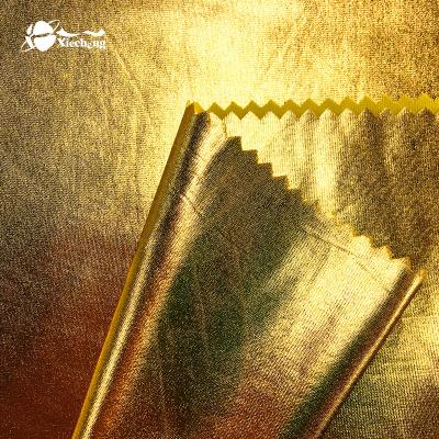 China Plain Shiny Gold 85%poly 15%spandex Foil Swimwear Fabric for sale