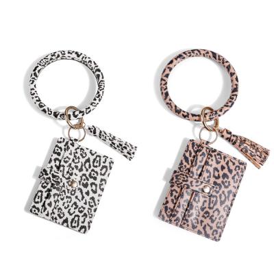 China Promotional Gifts Tassel Key Chain Leopard Print Pu Cards Case Wristband Explosive Leather Pendant Keychain for sale