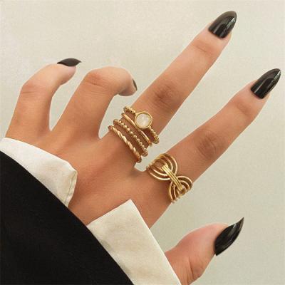 China New 5Pcs Romantic Minimalist Hollow Twist Dough Rings Set Opal Rings For Women Stackable for sale