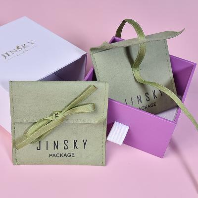 China JINSKY Custom Jewelry Packaging Earring Divider Microfiber Closure Suede Jewelry Snap Pouches With Bow-knot for sale