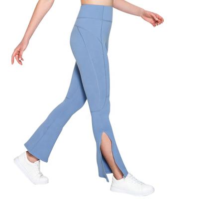 China Breathable Naked Yoga Pants Women Sense Slit Peadch Tiny Flare Hip No High Elastic Embrace Exercise Pants for sale