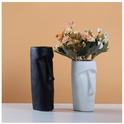 China Modern Custom Wholesale White Pink Black Nordic Bulk Round Hollow Rustic Modern White Flower Ceramic Vases For Home Decor for sale