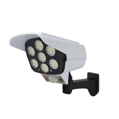 China Simulation of Garden CCTV LED Monitoring Security Lighting Outdoor Motion Sensor Solar Wall Lamp for sale