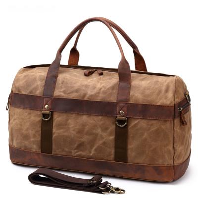 China Fashion logo custom vintage large capacity travel outdoor shoulder men weekend canvas genuine leather waterproof duffel bag for sale