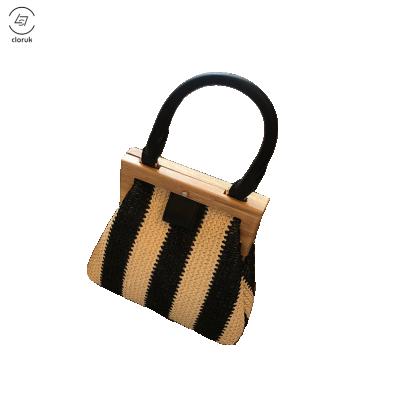 China Retro Vintage Straw Bag With Shoulder Strap Fashion Clip Wooden Design Style Rattan Bag Straw Tote Bags for sale