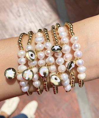 China FASHIONABLE Custom Pearl Bracelet Freshwater Pearl Bracelet Handmade Copper Gold Plating With Moon Star Eye Charm Bracelet for sale