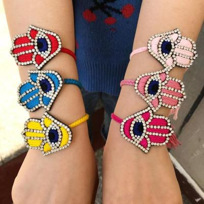 China FASHIONABLE Handmade Weave Beads Evil Eye Bracelets Customized Colorful Hand Shape Women Fashion Bead Palm Zircon Diamonds Bracelets Luck for sale