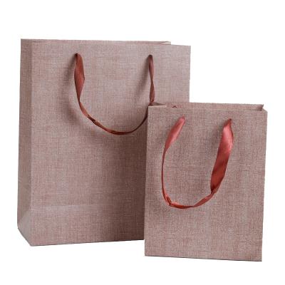 China Handmade Custom Logo Printed Shopping Gift Paper Bag With Handle Kraft Paper Packaging Bags for sale