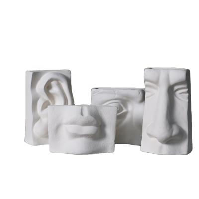 China Europe Personality Nordic Abstract Features Cement Facial Flower Pot for sale