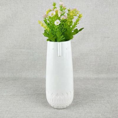 China Nordic Traditional Abstract Ceramic Vase Porcelain Kettle Face Kettle Face European INS Ceramic Vase For Flowers for sale