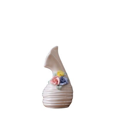 China Minimalist Europe Mini Shaped Ceramic Flower Aromatherapy Vase for sale