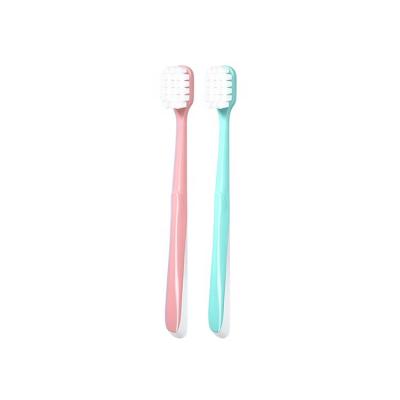 China Soft 2 In 1 Adult Toothbrush Factory Direct Square Hole Cheap Soft Stiffened Toothbrush For Adult for sale