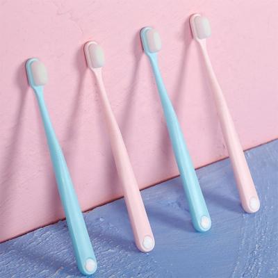 China Couples Soft Hot Sale Adult Toothbrush 10 Thousand Bristle PVC Soft Pack Adult Toothbrushes for sale