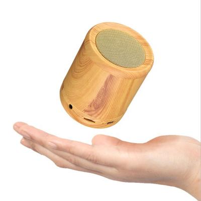 China Wireless Small Hands Free Call Quran With Blue Tooth Cylinder Speaker Bookshelf Speaker Wooden Table for sale