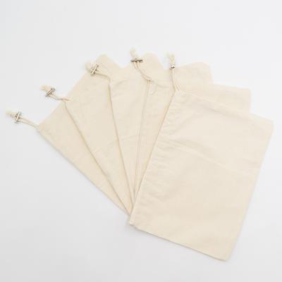 China BIODEGRADABLE eco friendly natural cotton canvas drawstring bag with custom label logo for sale