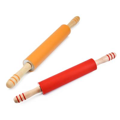 China Viable Hot Selling Wooden Handle Silicone Dough Baking Tools Pin In Various Colors for sale