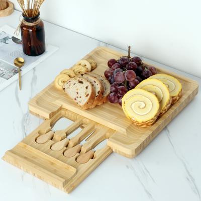 China Sustainable Bamboo Cheese Cutting Board Cheese Serving Tray With Cutlery Knife Set for sale