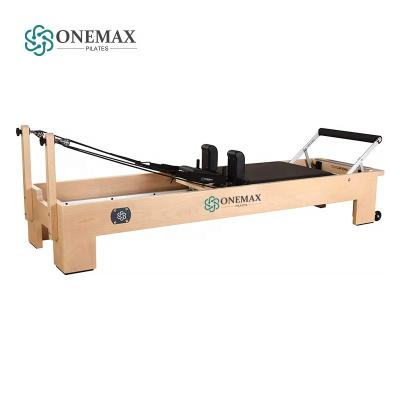 China ONEMAX Pilates Home Body Fit Exercise Bed Pilates Reformers Maple Wood Core Reformers Equipment Training Machine For Sale for sale