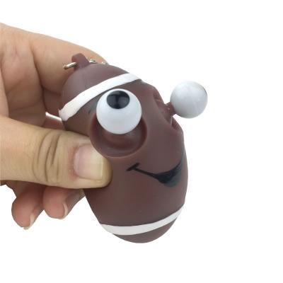 China Promotion Gift Kawaii Cartoon PVC Anti Stress Squeeze Eye Snap 3D Shape Rugby Ball Key Chain for sale