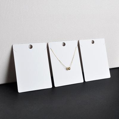 China Custom Korean Jewelry Tag LOGO Necklace Card Ornament Packaging Earring Paper Card High Grade Waterproof Stain White for sale