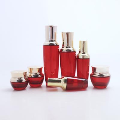 China Cosmetic shiny red glass bottle with sprayer and cap for containing perfume for sale