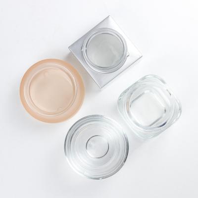 China Clear Round Cream Glass Bottle Cosmetic Frosted Different Sizes Cosmetic Container With Lid for sale