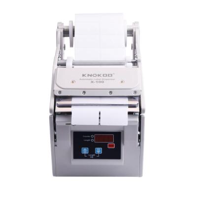 China CLOTHING Automatic Electronic Label Dispenser Machine X-100 Sticker Separating Label Dispenser for sale