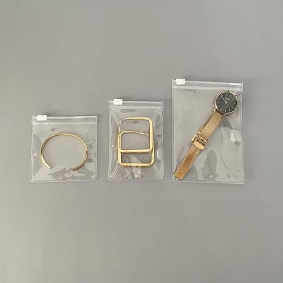 China Portable See Through Pouch Transparent Clear Jewelry Display Bag Bracelet Packaging Pouch With Adhesive Zipper Sealing for sale